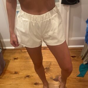 white leather shorts